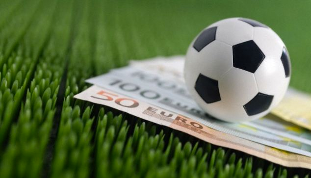 Soccer ball on top of Euro bank notes